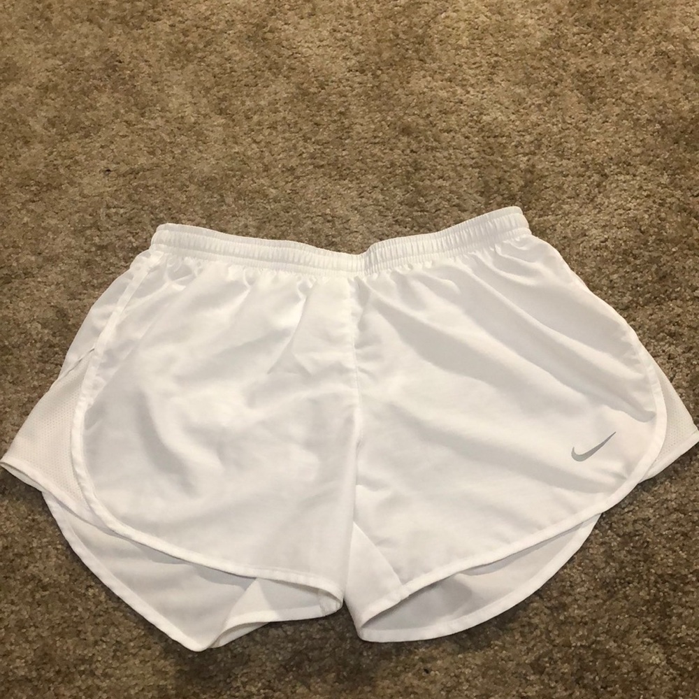 White Nike running shorts